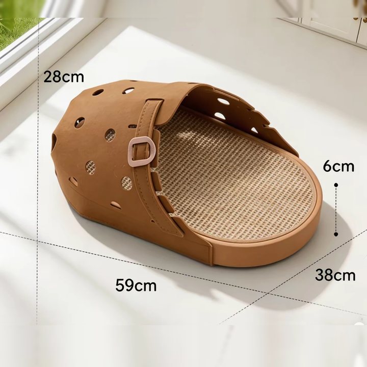 The client's product listing photo of the brown clog-shaped cat bed with its dimensions marked